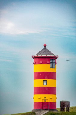 Germany, Pilsum. Famous lighthouse of Pilsum on the Wadden Sea in East Friesland. September 23 , 2022 clipart