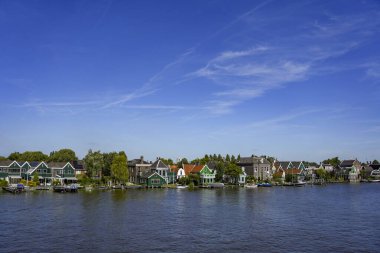 Zaanse Schans , Netherlands. July 29, 2024. Famous landmark Zaanse Schans with his historical buildings and windmills. Museum area. clipart