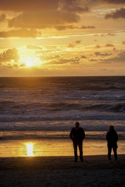 Egmond, Netherlands. September 10, 2020. North Sea scenery at the beach  of Egmond aan Zee during dusk clipart