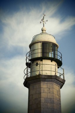 Atlantic coast on the Rias Baixas in Galicia , Spain. Famous lighthouse of Larino near carnota clipart