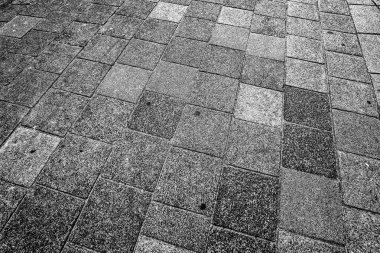 Flat stones in grid. A quiet surface with rhythm, weight, and tactile geometry
