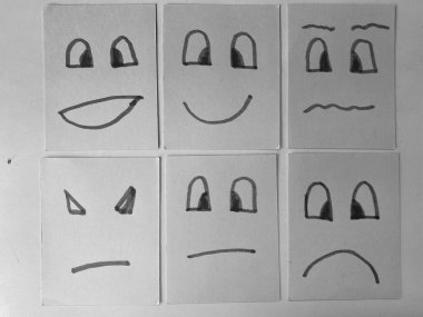 Siyah bir arkaplanda bir dizi farklı duygu