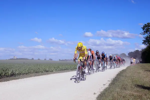 Stock image Troyes, France  7 July 2024. Tadej Pogacar of UAE Team Emirates leads a group of riders along gravel roads on stage 9 of the 2024 Tour de France