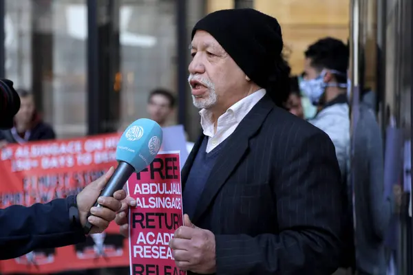 stock image A Bahraini activist talks to media during a protest outside Formula 1s offices in London, UK on March 18, 2022, ahead of the grand prix in Bahrain