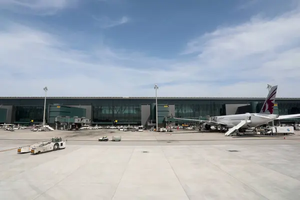 stock image Doha / Qatar  February 18, 2020. A Qatar Airlines plane on the stand at Hamad International Airport, Doha, Qatar