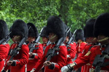 Members of the Household Division march down Birdcage Walk, central London, during rehearsals for Trooping the Colour on 31 May 2017. clipart