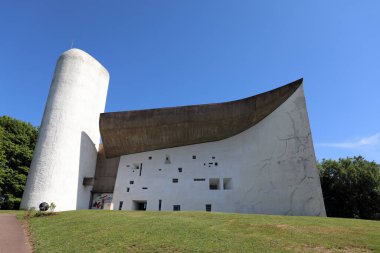 The southern face of the Notre Dame du Haut chapel in Ronchamp, France, designed by architect Le Corbusier. The chapel is on the Unesco World Heritage List. clipart