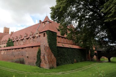 The defensive walls of Malbork Castle, built by the Teutonic Knights in the town of Malbork, Poland, photographed on 21 August 2017 clipart