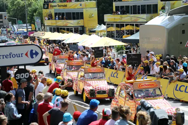 stock image Citroen 2CV cars advertising local sausage brand Cochonou parade up the finish straight at Longwy as part of the publicity caravan on stage 3 of the 2017 Tour de France