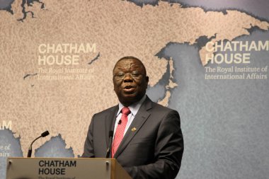 Morgan Tsvangirai, former prime minister of Zimbabwe and leader of the Movement for Democratic Change party, gives a speech at Chatham House think-tank in London on Friday, 25 July 2014 clipart