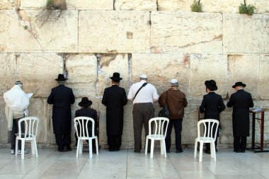 Jewish worshippers pray at the Western Wall  in East Jerusalem on Friday 23 March 2012 clipart