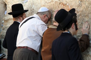 Jewish worshippers pray at the Western Wall  in East Jerusalem on Friday 23 March 2012 clipart