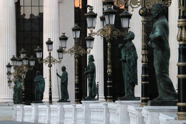 Statues on the bridge across the Vardar River leading to the Archaeological Museum in Skopje, Macedonia  clipart