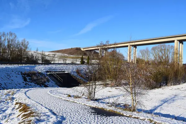 stock image Autobahn bridge above a snow covered valley