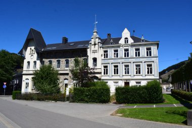 the old town hall of Malmedy, front with flags clipart