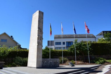 flags at the town hall of Saint Vith clipart