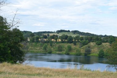 the beautiful lake Weinfelder Maar in the Eifel clipart