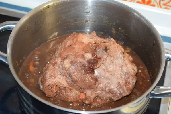 cooking meat in a pot.