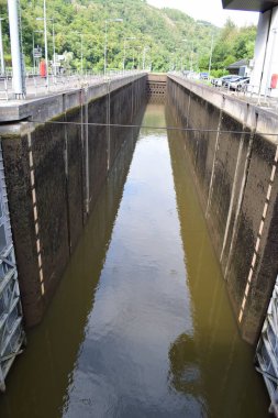 empty ship sluice of river lock and sluice system of the Saar at Mettlach clipart