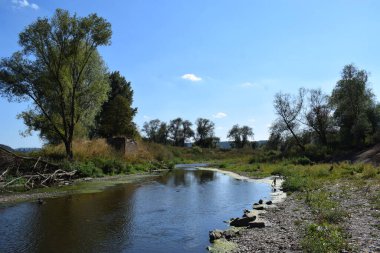 river with a destroyed bridge