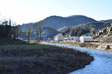 Ahr with Mayschloss in background, flood damage still visible clipart