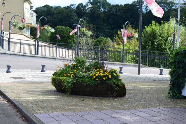 street view in France with flowers and flags in the Lorraine clipart