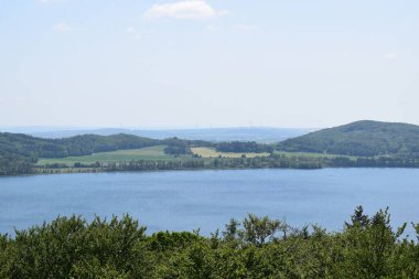 view from the lake to the mountains, Laacher See in the Eifel clipart