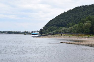 passenger ship docking at the almost dry Rhine shore NAmedy clipart