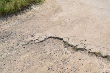 asphalt road with cracks clipart