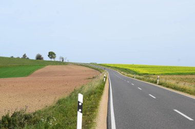 scenic view of countryside with a road clipart