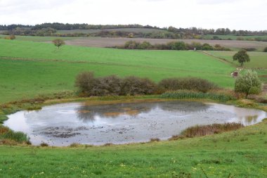 Trautzberger Maar in autumn light clipart