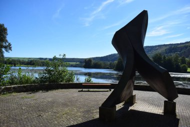 Lake Echternach with an artwork at the shore clipart