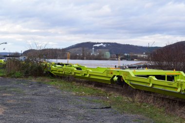 the yellow train at the flooded Rhine clipart