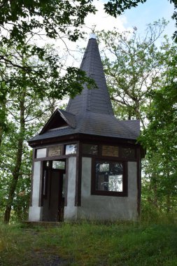 a small wooden house with a roof clipart