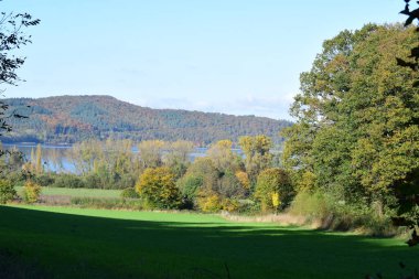 Laacher See, caldera lake in autumn landscape clipart