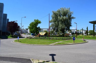 traffic circle in Behren les Forbach with mining heritage symbols clipart