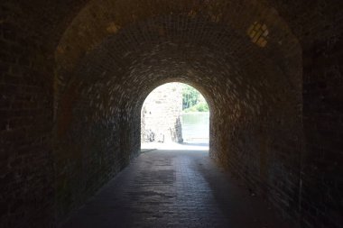 a closeup shot of a stone tunnel with an arch  clipart