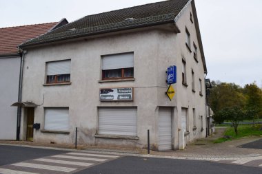 former Kiosk with faded signs clipart