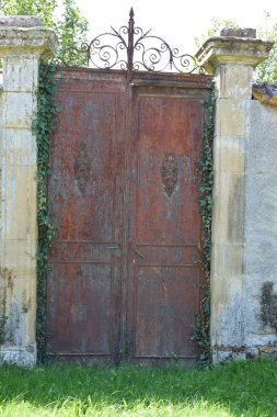 old rusty door in the garden clipart