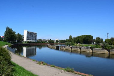 a view of the river Moselle in Thionville with reflections clipart