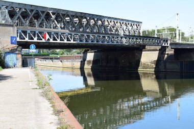 the bridges on two levels crossing each other and the Moselle in Thionville clipart