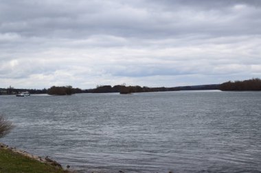 Rhine with islands and passing ships clipart