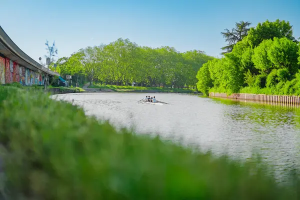 stock image Rowing Team Rows a Skiff on a River