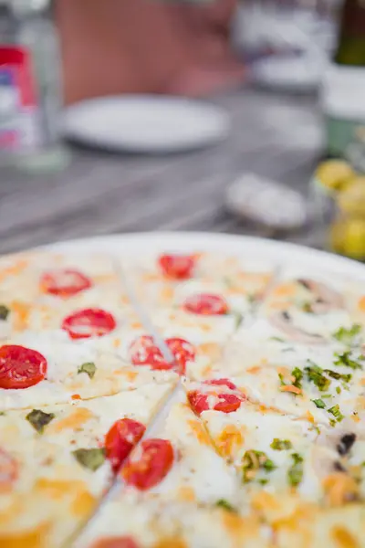 stock image Slices of Fresh French Flammkuchen with Creme Fraiche and Tomatos