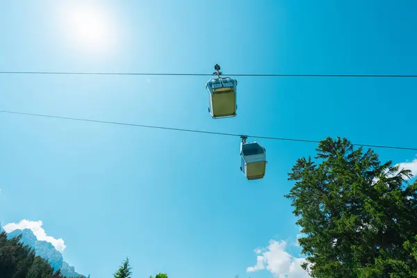 stock image Cable Car Gondola Cabins VIewed from Bottom Up on a Hot Sunny Summer Day