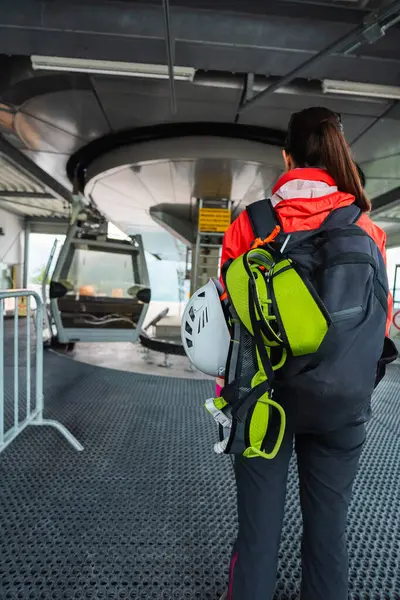 stock image Woman Climber with Equipment Waiting for the Cable Car Gondola Cabine at the Lift Station