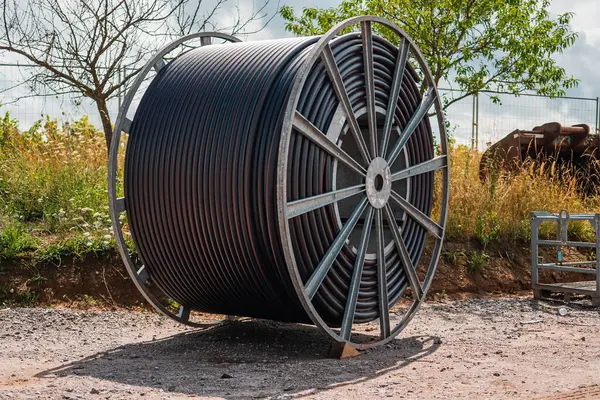 stock image Big Black Cable Reel as Material for an Underground Construction Work