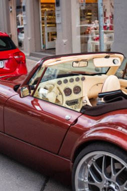 Interior of an Exotic Sports Car Convertible Cockpit with Analog Instruments and Nostralgic Look in the Full Leather Covering clipart