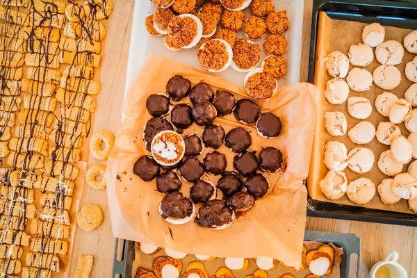 stock image Christmas Bakery with Choclate Covered Macroons Cookies Biscuits for Christmas Top Down View