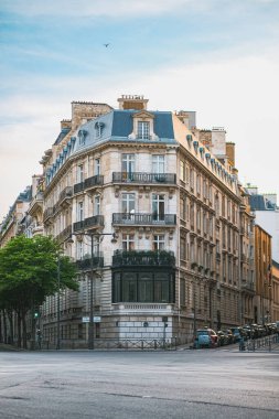 Renaissance Corner Building Infront of a Street Crossing in Paris France During Sunset clipart